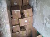 many boxes stacked on top of each other in a room