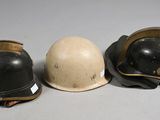 three helmets sitting next to each other on a table