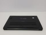 a black laptop sitting on a white table