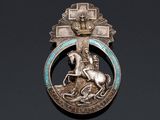 an image of a silver broochle with a horse and a man on a horse