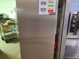 a stainless steel refrigerator in a commercial kitchen