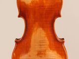 an old violin with a wooden back and bow on a white background
