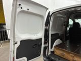 a white van with a wooden table in the back of it
