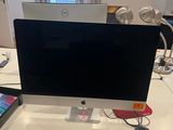 a desk with a laptop and a monitor on it
