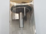 an image of a metal object on a white surface