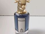 une image représentant un flacon de parfum orné d'une tête de taureau