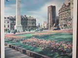 a picture of a picture of a city with a monument in the middle of it