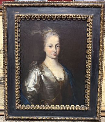 a painting of a woman in a blue dress in a gold frame