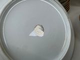 a close up of a plate with a heart on it