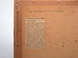 an old book with writing on it sitting on a table