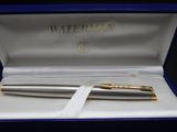 an image of a pen in a box with a ribbon around it