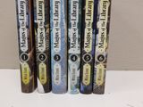 the spines of the books are lined up in a row