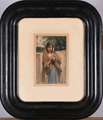 painting of a woman holding a cat in a black frame on a shelf