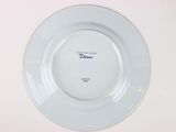 a white plate with a black writing on it