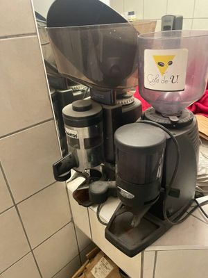 a coffee grinder sitting on top of a counter in a kitchen