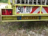 a yellow truck that is parked on the side of the road