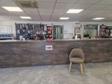 a chair sitting in front of a counter in a store