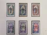 an image of a collection of stamps on display on a wall