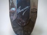 a vase that has a picture of a man on it