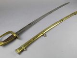 a close up of two swords on a white surface