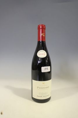 a bottle of wine that is sitting on a table
