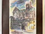 un vieux livre sur lequel figure l'image d'une cathédrale