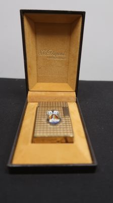 a box with a ring inside of it on a table