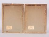 pair of antique wooden picture frames with labels on them on a white background