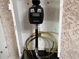 a picture of a meter with a hose attached to it