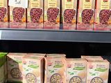 many boxes of cereal on the shelves in the store