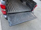 an image of a pickup truck with its bed open