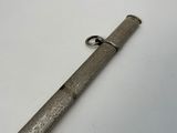 a close up of a metal object on a white surface