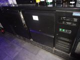 an image of a bar with a bunch of bottles on it