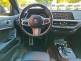 a view of the inside of a car from the driver ' s seat