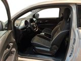 a silver car with black leather seats and a steering wheel