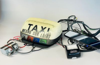 a cell phone and a car charger sitting on a table