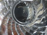 a close up view of a glass vase with a black lid