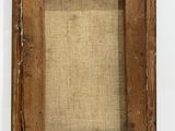 an old wooden picture frame with a linen backing on a white background