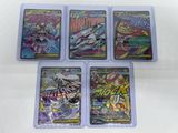 four card game cases with various comics on them on a white surface