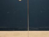 an image of a lamp that is on a stand in front of a wall