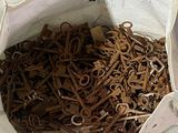 a white bag filled with lots of scissors on a table
