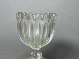 a glass bowl that is sitting on a table