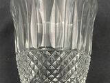 a glass vase that is sitting on a table