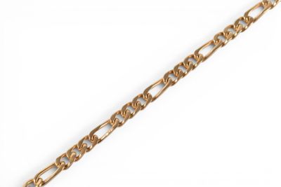 a close up of a gold chain on a white background