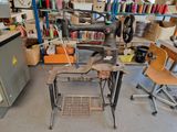a sewing machine sitting on a table in a room