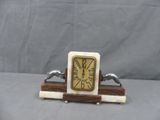 a small clock that is sitting on a table