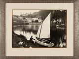 a black and white photo of a sailboat on the water