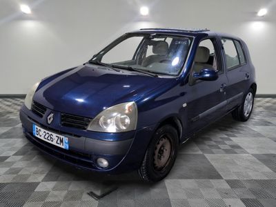 a picture of a small blue car parked in a garage