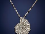 a white gold and diamond pendant on a chain