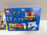 a box with a lego fire truck and a box with a picture of a fire truck